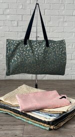 Assorted LDS temple bags in various styles and colors displayed side by side