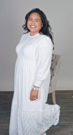 Stretch lace dress with a zip up front with two deep pockets. Zurich easy care.