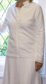 Fortaleza Suit #2554 - White lace LDS Temple suit with a front-zip jacket and A-line skirt, featuring side vents and deep pockets.