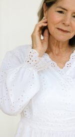 Feminine LDS temple dress from the Branson collection with white eyelet fabric and classic silhouette